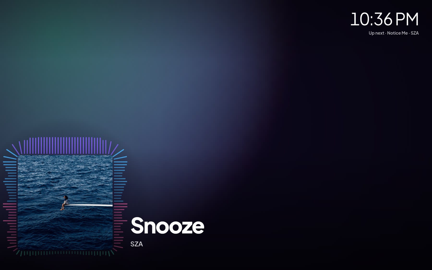 Full-screen Now Playing with a background painted from the album cover, spectrum bars around the artwork and a clock